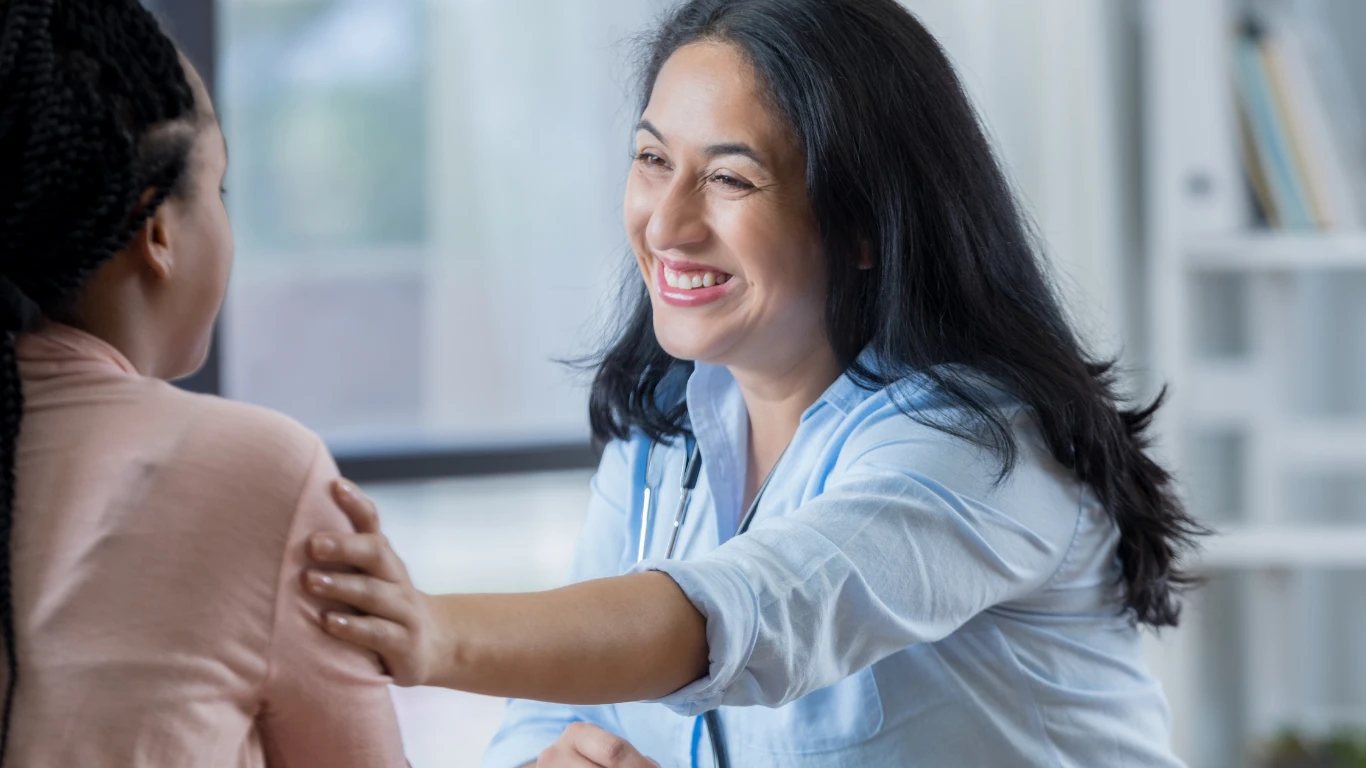A doctor warmly connecting with a patient